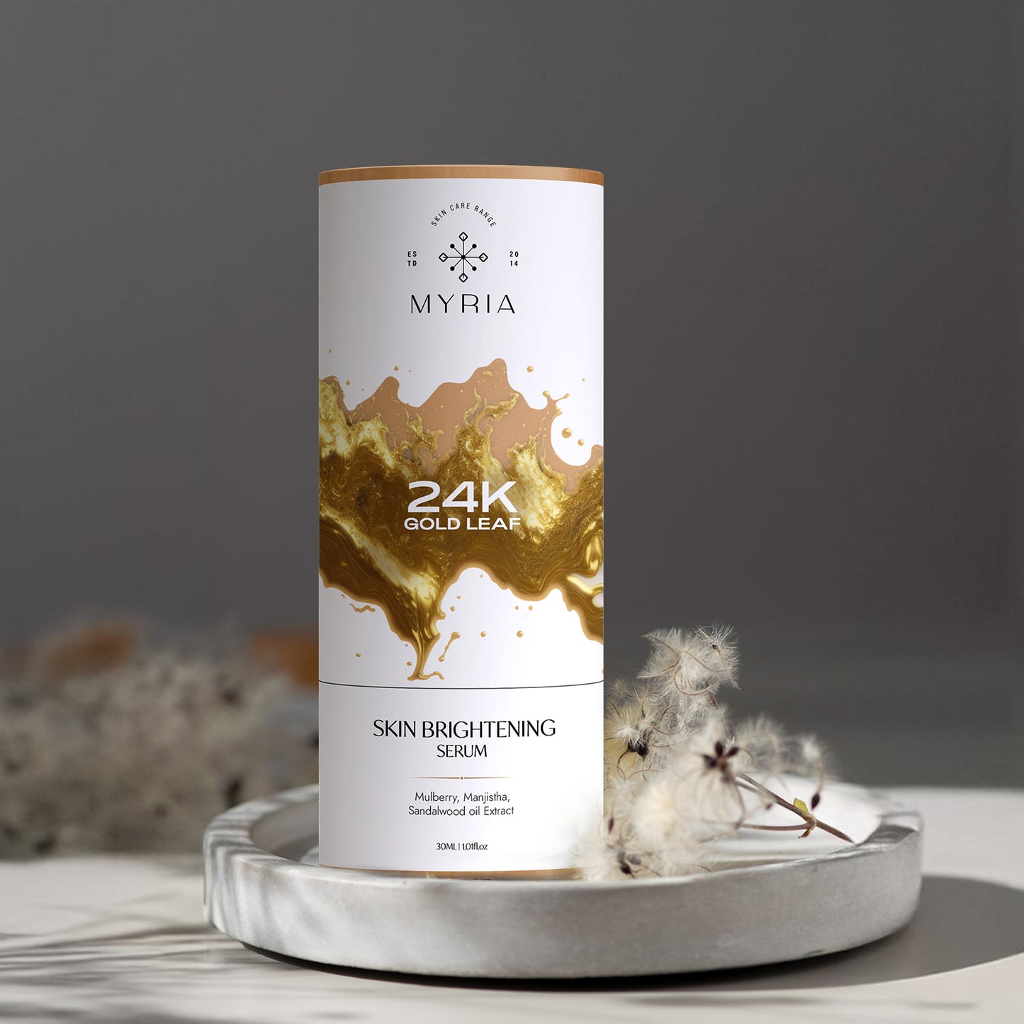 A bottle containing 24K Gold Leaf Skin Brightening Serum.